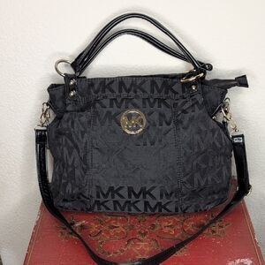 Michael Kors black logo bag with strap.